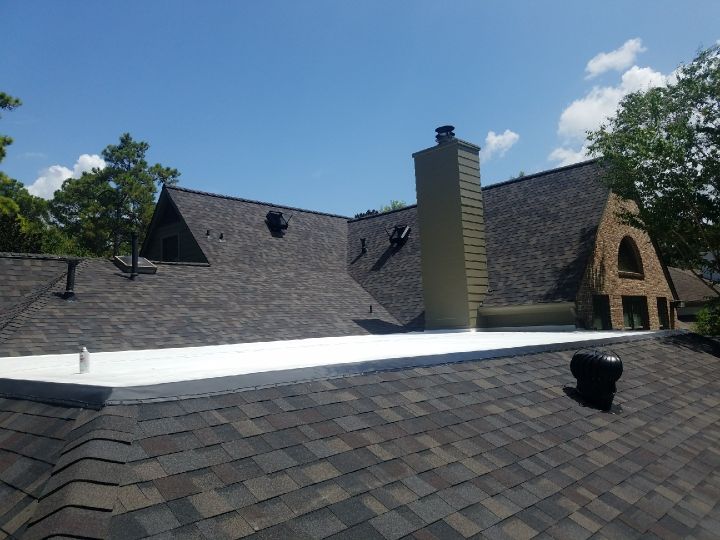 Owens Corning Roof and a white Versico TPO roof