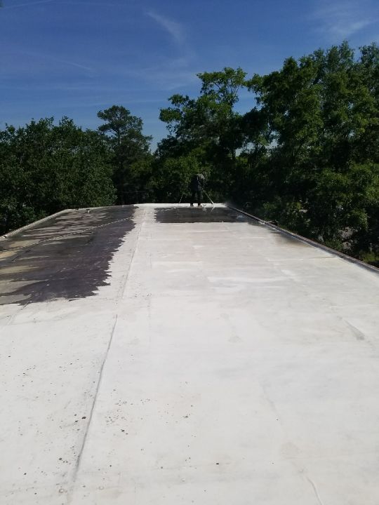 Power washing an existing TPO on a church